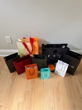 Collection of designer shopping bags and boxes